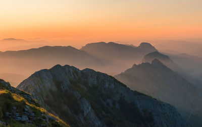 Scenic view of mountains against sky during sunset