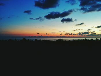 Scenic view of silhouette trees against sky during sunset