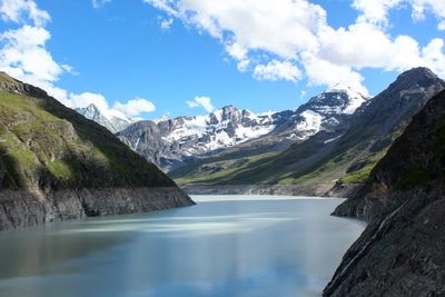 Scenic view of grande dixence dam amidst mountains during winter