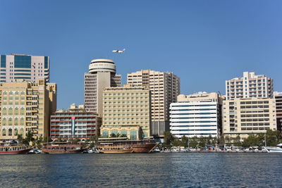 Buildings against clear sky in city