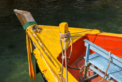 High angle view of yellow rope tied up on boat