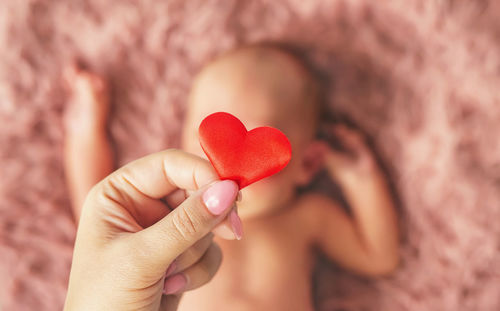 Cropped hand holding heart shape