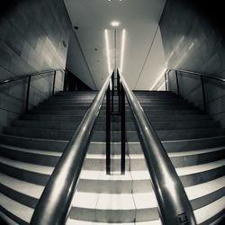 Low angle view of steps in illuminated building 