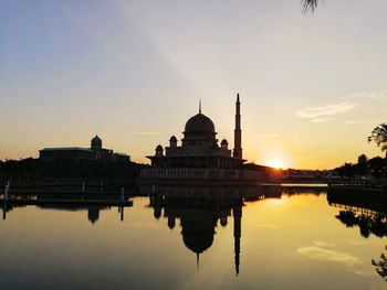 Silhouette of temple against sky during sunset