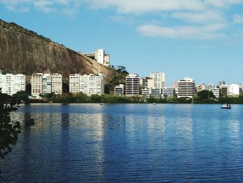 Cityscape by lagoa rodrigo de freitas against sky