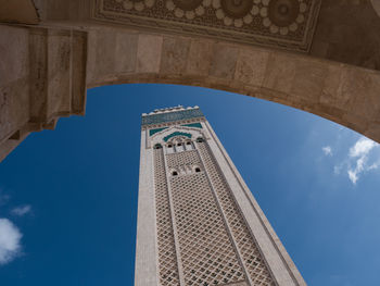 Low angle view of mosques against blue sky