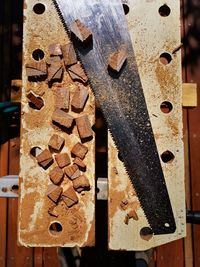 Close-up of rusty metal on wood