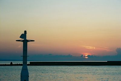 Scenic view of sea against clear sky during sunset