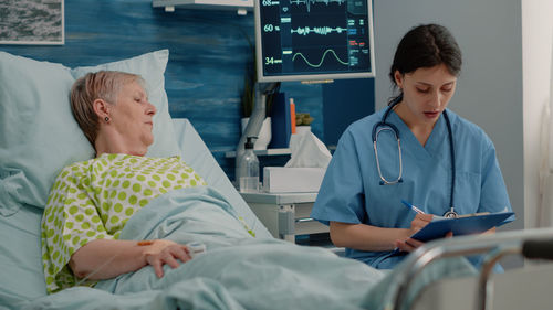 Doctor consulting patient at hospital