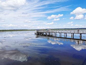 Pier over sea against sky