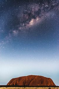 Rocky mountain against star field sky