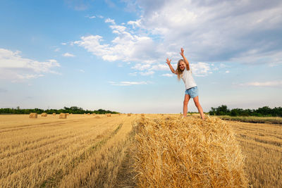 Man standing on field against sky