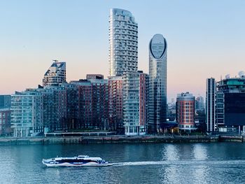 View of modern buildings in city against sky