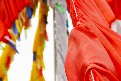 Close-up of red bell hanging in temple