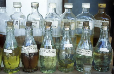 Wine bottles kept in order on table