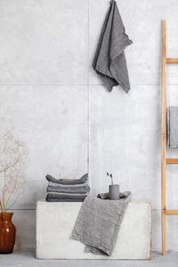 Clothes drying on table against wall at home