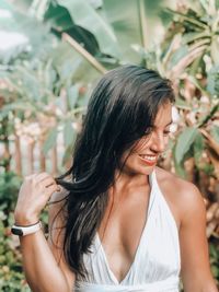 Close-up of smiling woman with long hair