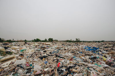 View of garbage in row against clear sky