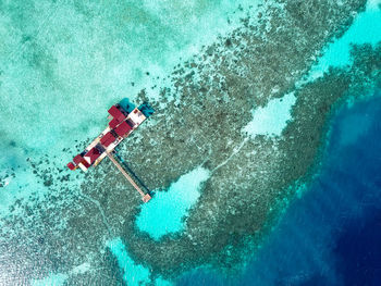 Aerial view of water chalet in egang egang near bum bum island during sunrise.