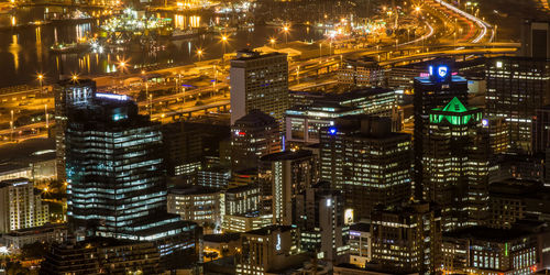High angle view of illuminated buildings in city at night