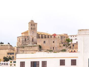 Low angle view of buildings against clear sky