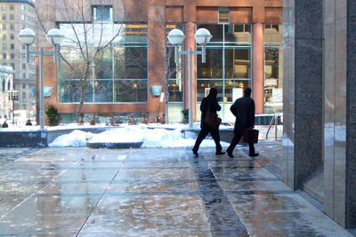 People walking in snow during winter