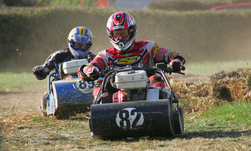 Man riding motorcycle on field