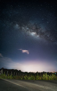 Scenic view of field against sky at night