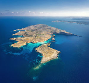 Aerial view of sea and island against sky