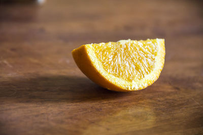 Close-up of orange slice on table