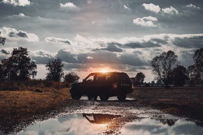 Scenic view of field against sky during sunset