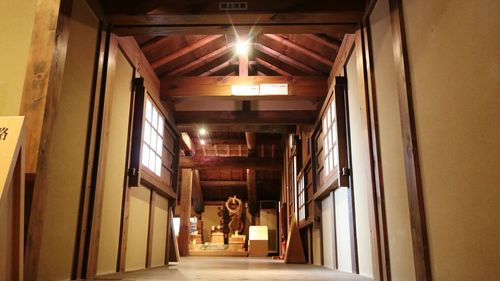 People walking in corridor of building