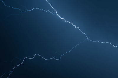 Low angle view of lightning in sky at night