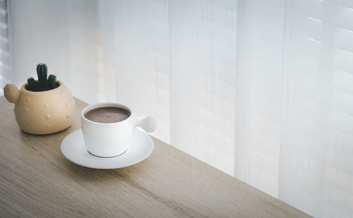 Coffee cup on table