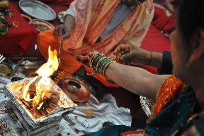 Bride and groom performing rituals at wedding