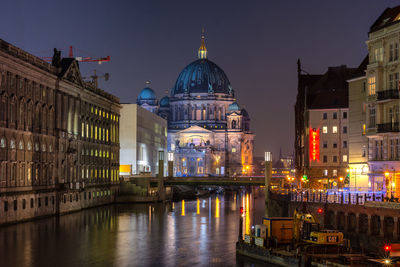 Illuminated buildings in city at night