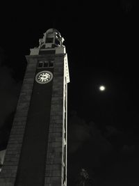 Low angle view of illuminated building against sky