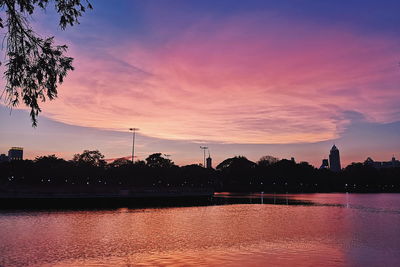 Scenic view of lake against orange sky