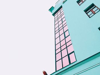 Low angle view of building against clear blue sky