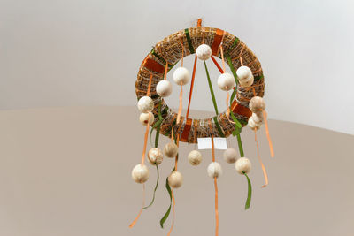 Close-up of decoration hanging against wall