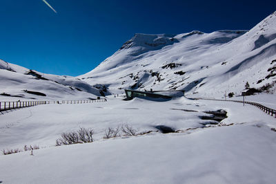 Scenic view of snow covered mountains