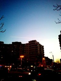 View of city street against blue sky