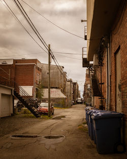 Street amidst buildings against sky in city