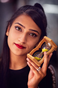 Close-up portrait of a woman with hourglass