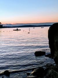 Scenic view of sea against clear sky during sunset