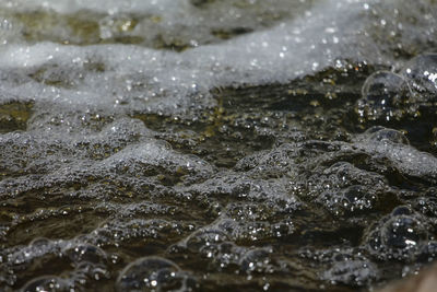 Close-up of water flowing through rocks