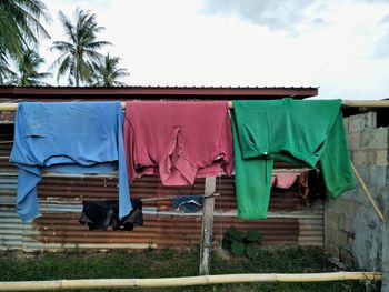 Low angle view of clothes drying against building