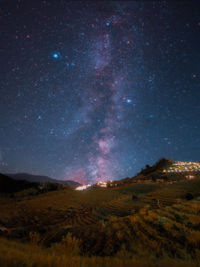 Scenic view of star field against sky at night