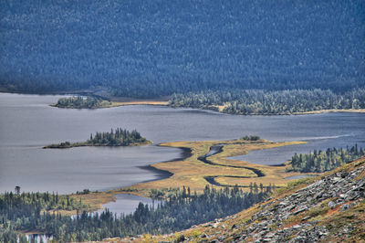 Aerial view of river by mountains