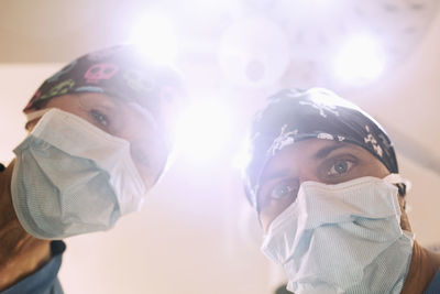 Low angle portrait of orthopedic surgeons in operating room